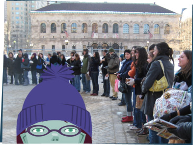 Many people standing outside in a big circle holding gifts