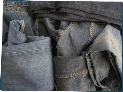 A pile of denim jeans