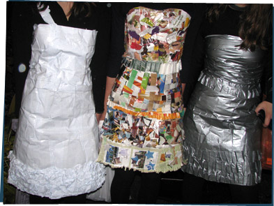 Three dresses, made of duct tape, old magazines, and graph paper