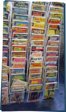 A rack of old comic books at a flea market