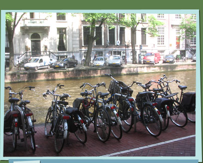 Bicycles parked by a canal