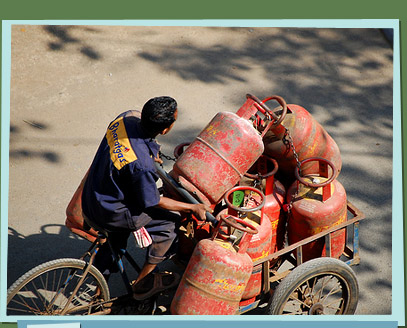 Man on bike delivering gas