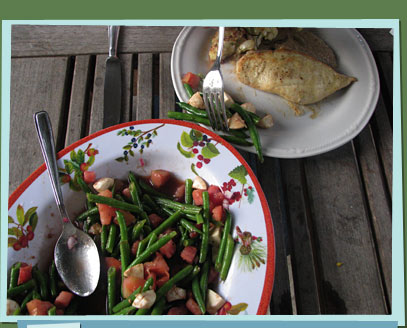 A green bean dish and a chicken dish.