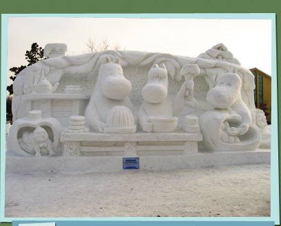Snow sculpture of characters cooking