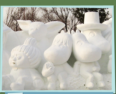 Snow sculpture of a family