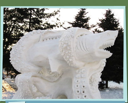 Snow sculpture of an octopus catching a shark