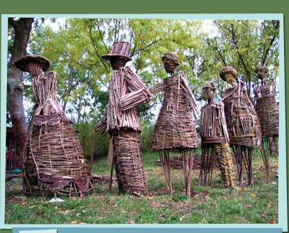 Branch sculptures of people standing in line