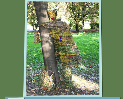 Branch sculpture of a woman hugging a tree