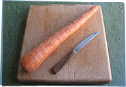Carrot and knife on cutting board